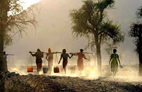 Girls carry buckets of water from a waterhole near Kuluku, Eritrea. Photo: Evelyn Hockstein/WFP
