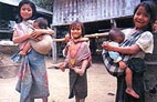 Girls with babies, Laos.  Photo: Jim Holmes