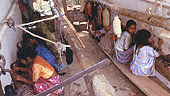 Children making carpets for export::© Mark Edwards/Still Pictures